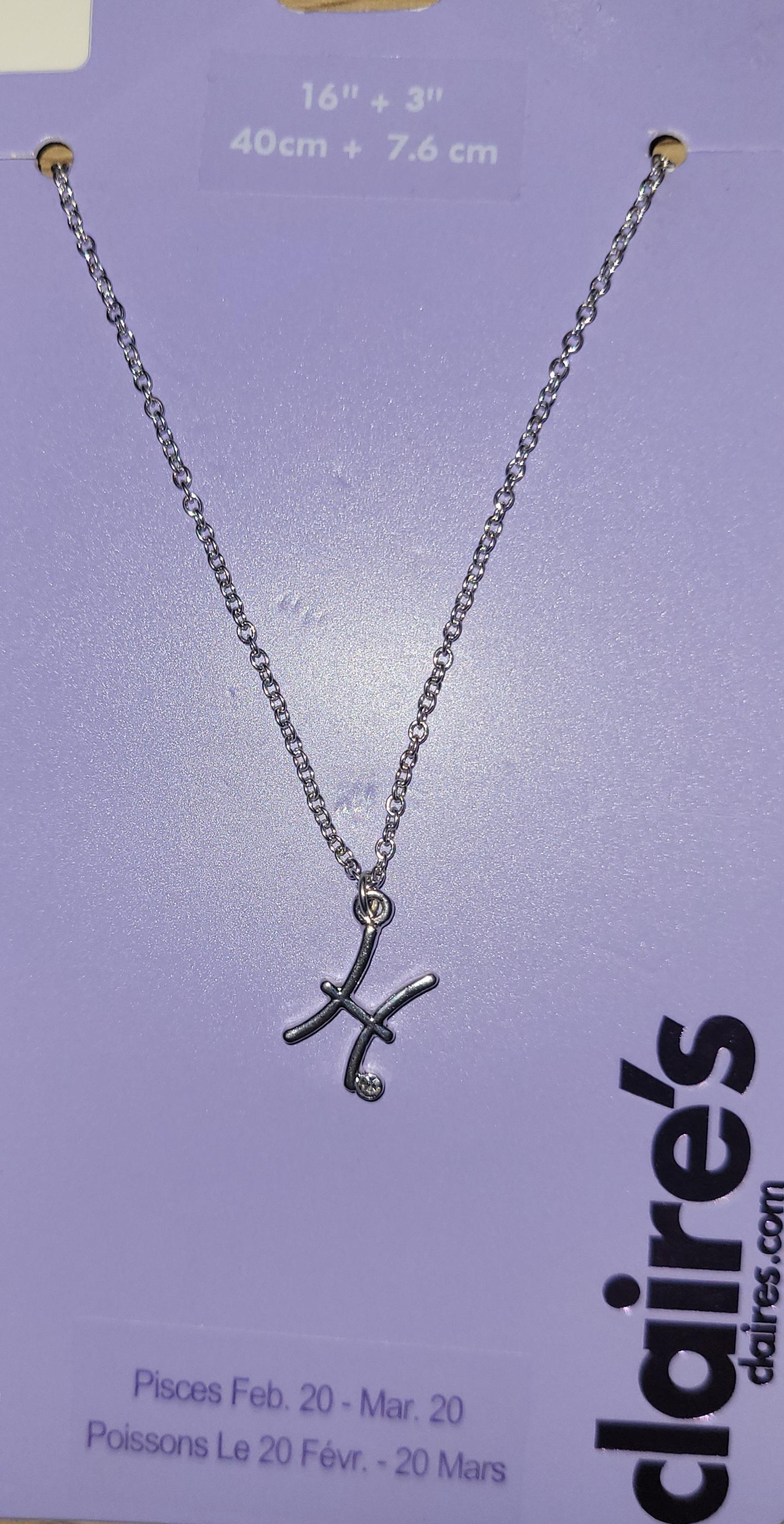 Stjernetegnsmykke Fiskene Pisces sølvfarget Claire's