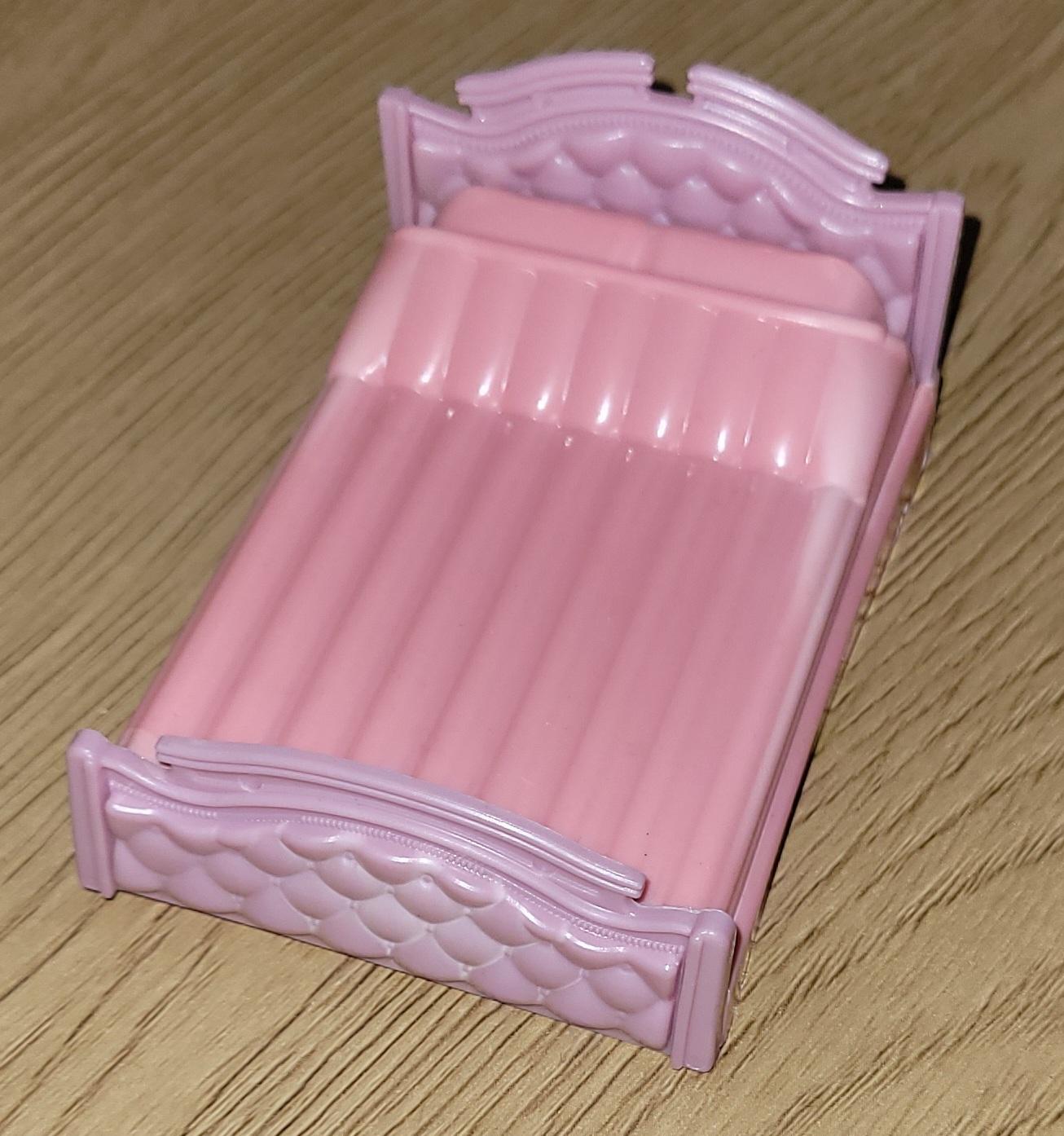 Liten dukkeseng i plast, rosa